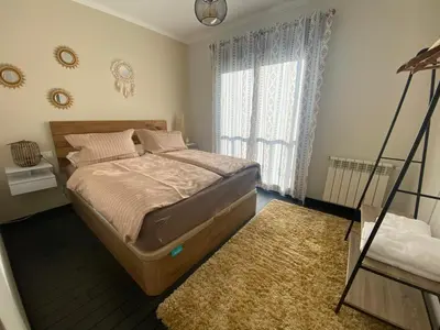 a bedroom with a bed and a window at Casa Lúa in Castro Caldelas