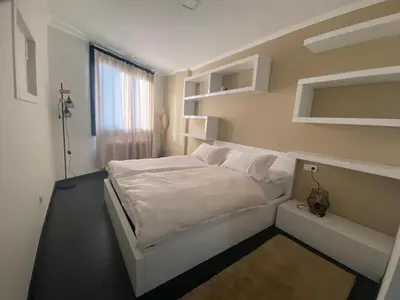 a bedroom with a white bed and a window at Casa Lúa in Castro Caldelas