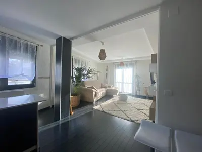a living room with a couch and a television at Casa Lúa in Castro Caldelas