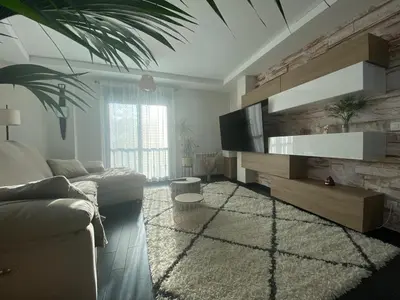 a living room with a couch and a tv at Casa Lúa in Castro Caldelas