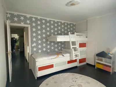 a bedroom with a bunk bed with an american flag wall at Casa Lúa in Castro Caldelas