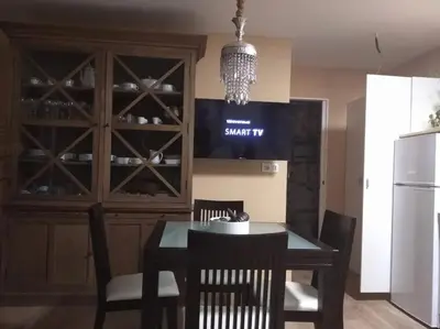 a dining room with a table and chairs and a wine cellar at Charming House in Parada with Large Garden in Parada