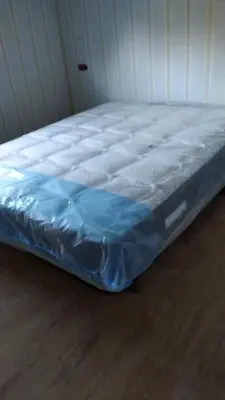 a bed in a room with a blue mattress at Charming House in Parada with Large Garden in Parada