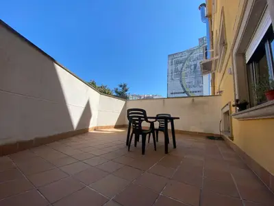 two chairs and a table on a balcony at Apartamento a 5 min caminando de la Playa Sta. Cristina, Oleiros (Terraza, Parkin, ) in Oleiros
