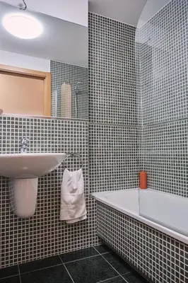 a bathroom with a sink and a bath tub at Pensión A Solaina 3 in O Pedrouzo