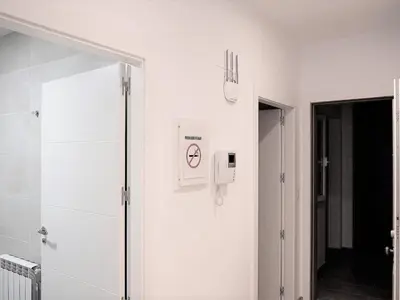 a bathroom with white walls and a walk in shower at Apartment in Ourense near Thermal Baths in Ourense