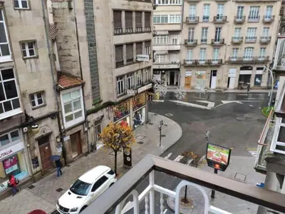 a view of a city street with a white car at Apartment in Ourense near Thermal Baths in Ourense
