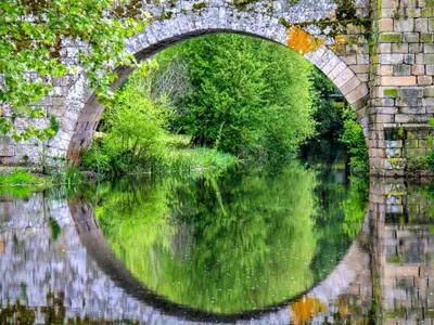 a stone bridge over a body of water at Apartment in Ourense near Hot Springs in Ourense
