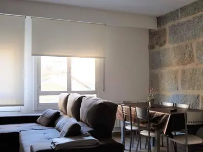 a living room with a couch and a table at Apartment in Ourense near Hot Springs in Ourense