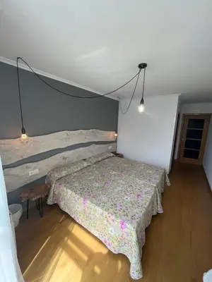 a bedroom with a bed in a room at ENTRECAMIÑOS in O Pedrouzo