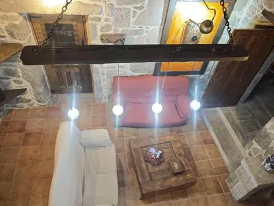 an overhead view of a living room with a chandelier at CASERIO RECTORAL DESTERIZ in Ourense