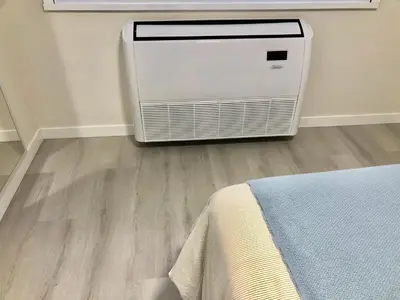 a room with a heater in the corner of a room at Apartamento Muralla in Lugo