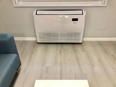 a heater in a living room with a wooden floor at Apartamento Muralla in Lugo