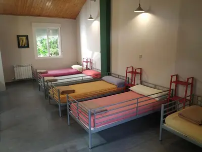 a row of bunk beds in a room at Albergue de la Piedra in Villafranca del Bierzo