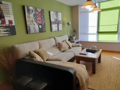 a living room with a couch and a table at NORAY in Ribadeo