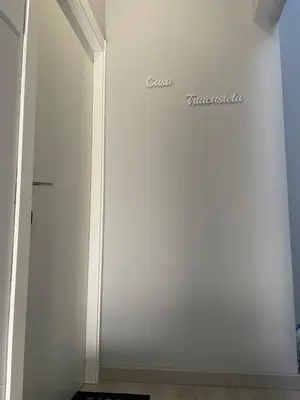 a white wall with a door in a room at Casa Triacastela in Tríacastela