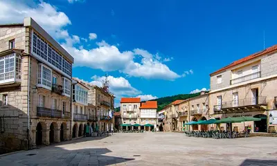 an empty street in an old town with buildings at Casiña da Madalena in Ribadavia