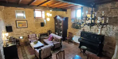 a living room with a couch and a fireplace at CASA DO SANTO in Santiago de Compostela