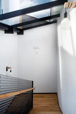 a room with a tennis net on a wall at Casa do cabo in Arzúa