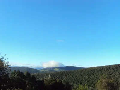 a view of a mountain with a fog in the distance at Casa de Lucas in Fonfría