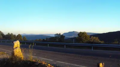 an empty highway with a view of the mountains at Casa de Lucas in Fonfría