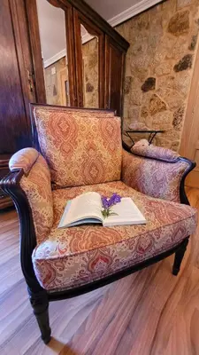 a book sitting on a couch with a book at La casita 