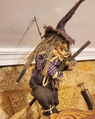 a statue of a person holding two guns at La casita 