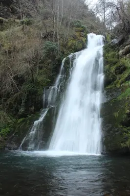 a waterfall in the middle of a river at La casita 