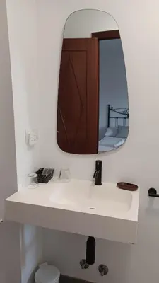 a bathroom with a white sink and a mirror at Hostal Boavista in Costoia