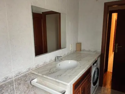 a bathroom with a sink and a mirror at Alojamiento Apostol 2 in Melide