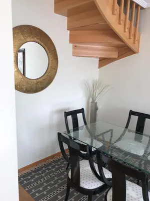 a dining room with a glass table and chairs at Apartamento para 6 personas con piscina y paddle in Foz