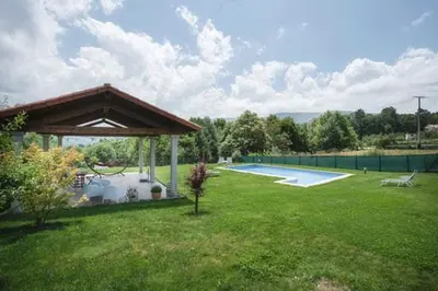 a backyard with a gazebo and a swimming pool at Casa Regente in O Viso