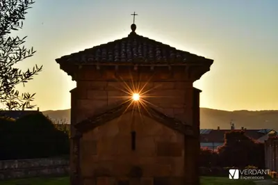 a church with a cross on top of it at Casa Regente in O Viso