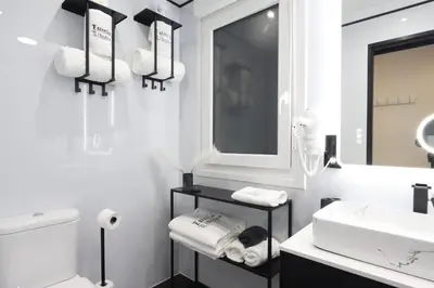 a white bathroom with a sink and a toilet at ESTRELLA de RIBADEO in Ribadeo