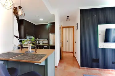 a kitchen with a wooden counter in a room at ESTRELLA de RIBADEO in Ribadeo