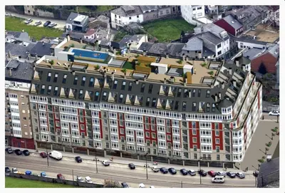 an overhead view of a large building with red windows at ESTRELLA de RIBADEO in Ribadeo