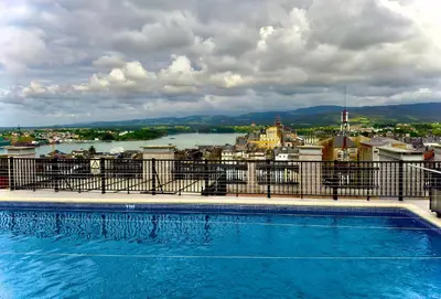 a swimming pool on top of a building with a view at ESTRELLA de RIBADEO in Ribadeo