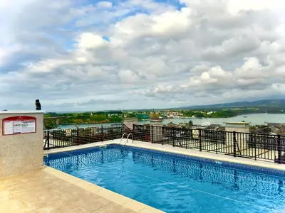 a swimming pool on top of a building at ESTRELLA de RIBADEO in Ribadeo