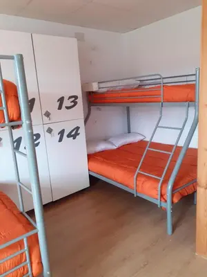 a bunk bed room with two bunk beds in it at ALBERGUE LEMAVO in Monforte de Lemos