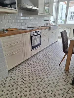 a kitchen with white cabinets and a stove at MAXIMO CONFORT in Lugo