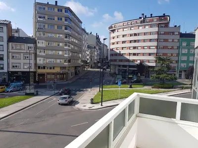 a view of a city street with tall buildings at MAXIMO CONFORT in Lugo