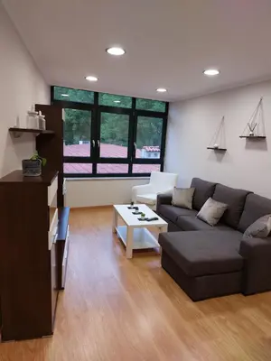 a living room with a couch and a table at Casa Tarrazo in Monforte de Lemos