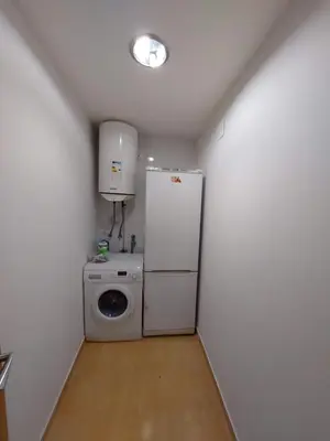 a laundry room with a refrigerator and a washing machine at Casa Tarrazo in Monforte de Lemos