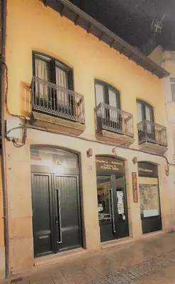a building with balconies on the side of it at Casa Tarrazo in Monforte de Lemos