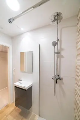 a bathroom with a shower and a sink at Ultreia Seven Rooms by Adeloló in Santiago de Compostela