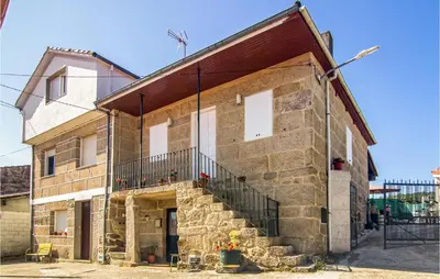 a large brick building with a staircase on it at Stunning Home In A Peroxa With Wifi in La Peroja