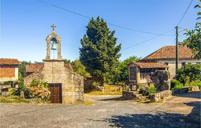 an old church with a cross on top of it at Stunning Home In A Peroxa With Wifi in La Peroja