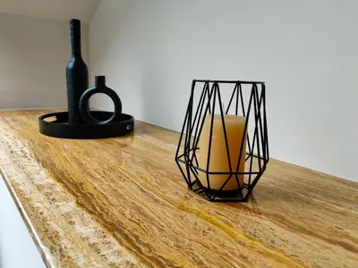 a vase and a candle on a wooden table at Alojamientos Viveiro - Ático Playa de Covas in Viveiro