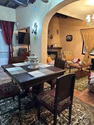 a dining room with a table and chairs in a room at O toxal in Monforte de Lemos