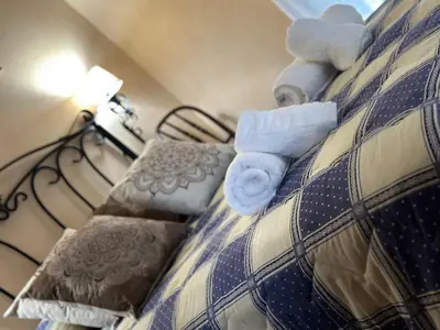 a bed with stuffed animals on top of it at O toxal in Monforte de Lemos